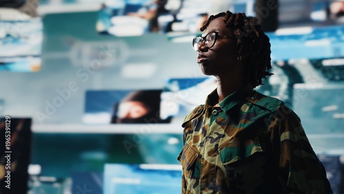 Photos Military officer oversees mission control on digital display showing intelligence feeds