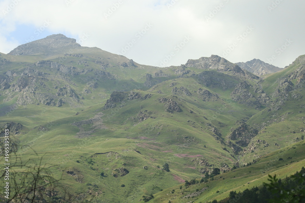 Obraz premium Mountain landscape of the North Caucasus mountains near Mount Elbrus on a sunny summer day