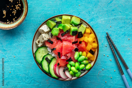 Vegan poke bowl with grapefruit, avocado, mango, edamame, overhead shot
