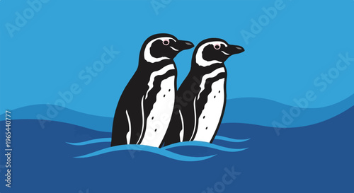 Two charming penguins stand upright in gentle ocean waves on a clear blue day