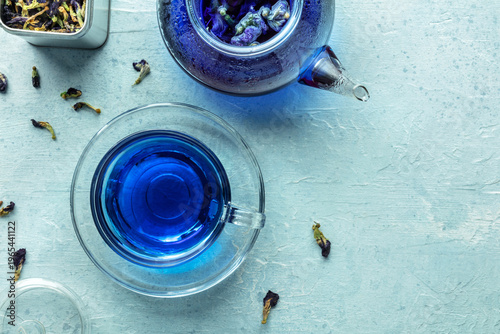 Blue tea, an infusion of butterfly pea flowers. A cup and a teapot, overhead