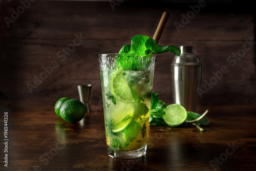 Mojito, fresh summer cocktail with mint, lime, and ice, side view