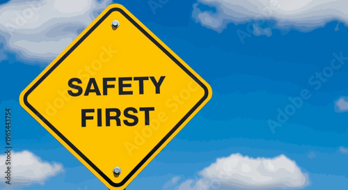 A yellow diamond-shaped sign reading SAFETY FIRST hangs under a blue sky with white clouds.