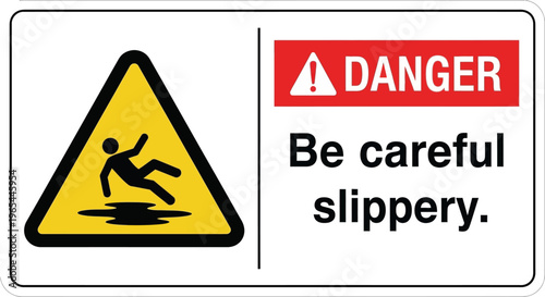 A cautionary sign warns people to be careful of a slippery floor with a hazard symbol.