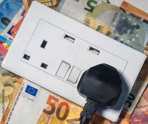 euro money and an electrical supply outlet