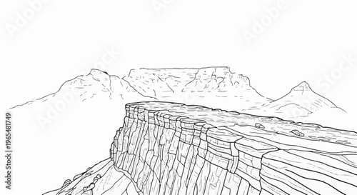 Dramatic cliff face overlooks vast, tiered canyons under a clear sky