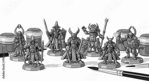 Fantasy miniatures, paints, and brushes arranged on a white surface
