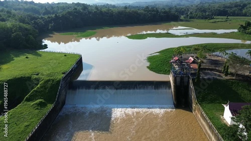 Murky water in a dam area showing sediment and low clarity. The scene highlights environmental conditions and water quality in a reservoir setting.