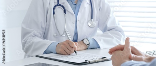 Принти на полотні Female medical professional filling prescription, advising patient on health issues during clinical consultation