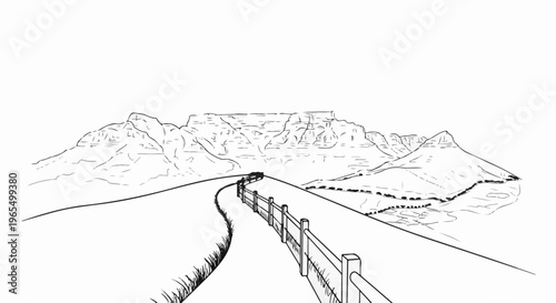 Winding road leads to a flat-topped mountain under a clear sky