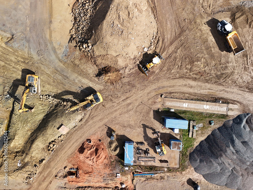 Aerial View of Construction Site with Excavators and Heavy Machinery