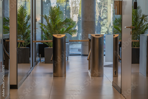 Modern office entrance with access control turnstiles and security system