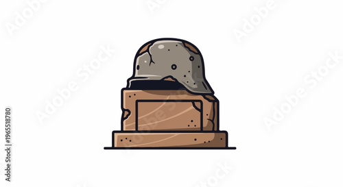 Old helmet on a stone monument with cracks and pitted surface