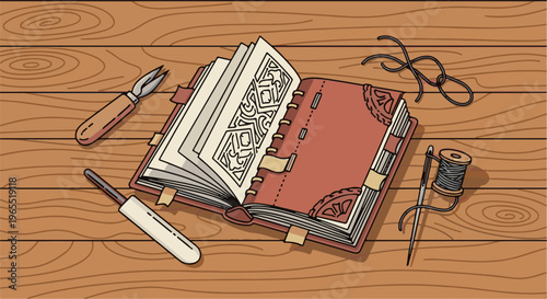 Open ornate book with crafting tools and thread on a wooden table