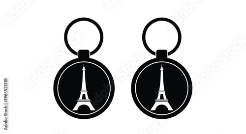 Two eiffel tower keychain silhouettes displayed on a white background
