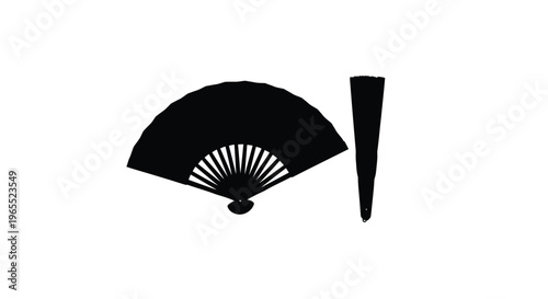 Elegant black fan and hair stick in a dark silhouette