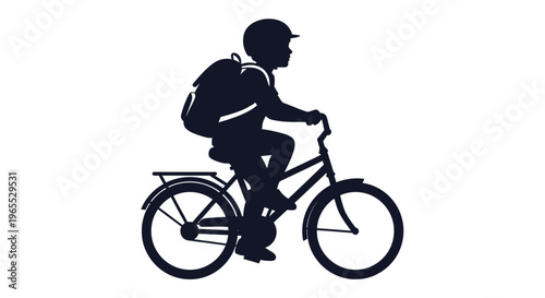 Silhouette of a boy riding bicycle.
