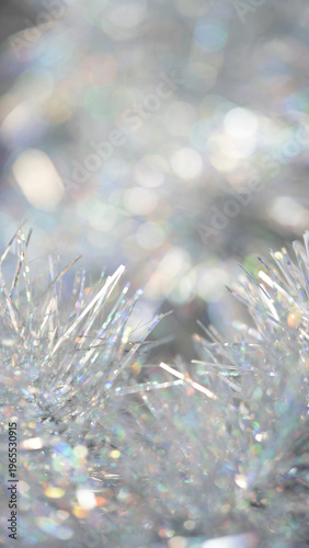 Close-up of shimmering silver tinsel with sparkling reflections and blurred background