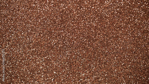 Brown glitter texture background with sparkling particles for creative design projects