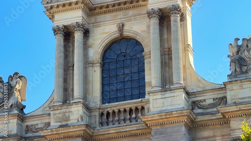 Close up of the Saint-Gervais-Saint-Protais church facade on a sunny day in Paris, France