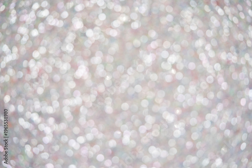 Abstract blurred background with shimmering bokeh lights in soft pastel colors for design