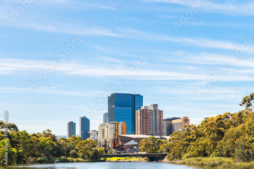 Adelaide city skyline viewed across the Torrens River toward the Adelaide Hills on a bright clear day in South Australia