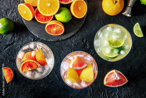 Wallpaper Mural Gin Tonic cocktails in copa glasses at a bar, with orange, pink grapefruit, and lime, overhead flat lay shot Torontodigital.ca