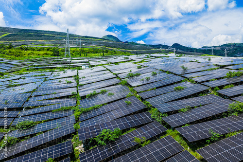 Tableau sur toile Photovoltaic solar panels at a vast mountain solar farm for sustainable green en