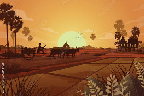 Silhouette of a farmer driving a bullock cart in a rural village at sunset
