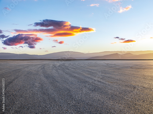 Empty asphalt road ground and mountain natural scenery at sunrise