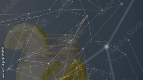 Glass jar featuring yellow liquid, lemon wedge on rim and honey dipper showing network overlay