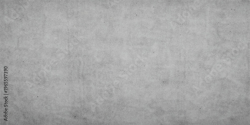 A dark grey brushed metal texture with a vintage grunge pattern on an aged concrete wall surface creating a rough black stone backdrop