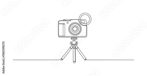 Vlogging Illustration. Minimalistic one-line drawing compact camera on tripod with small light ring outline, continuous single black line on white background,
