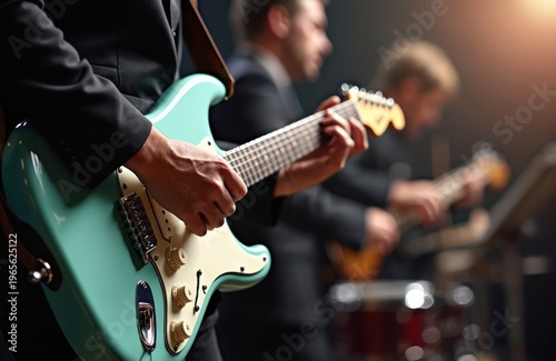 Musician plays electric guitar on stage. Band performs live concert with musical instruments. Focus on hands on guitar strings. Professional music performance.