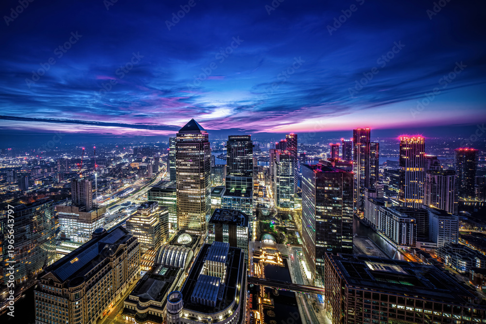 Fototapeta premium Elevated view of the Docklands and Canary Wharf district in London, England, during dawn sunrise
