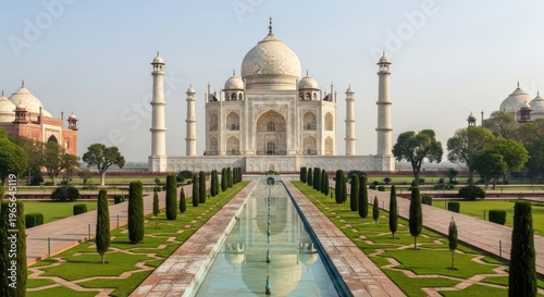 The majestic taj mahal viewed along a symmetrical garden pathway in agra india
