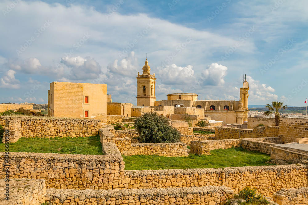 Ταπετσαρία Citadel in Rabat, Gozo, Malta, on a sunny day, featuring historic stone walls, ancient architecture, and panoramic views over the island under bright Mediterranean skies