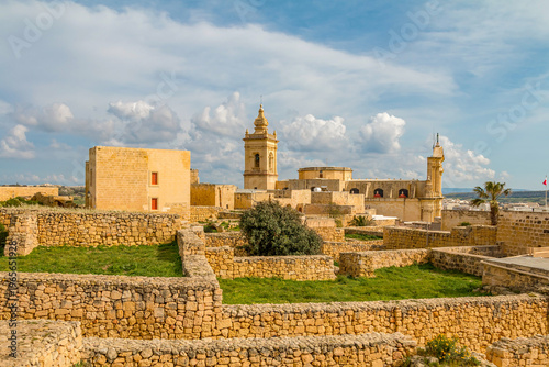 Obraz na plátně Citadel in Rabat, Gozo, Malta, on a sunny day, featuring historic stone walls, ancient architecture, and panoramic views over the island under bright Mediterranean skies