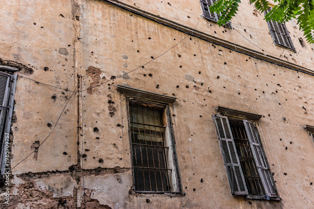 Naklejka premium Bullet holes covered house in Beirut, Lebanon