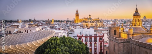 Panoramic view, city view, view from Metropol Parasol to many churches at sunset, Iglesia de la Anunciación, La Giralda and Iglesia del Salvador, bell tower of the cathedral of Sevilla, Catedral de Santa Maria de la Sede, Sevilla, Andalusia, Spain