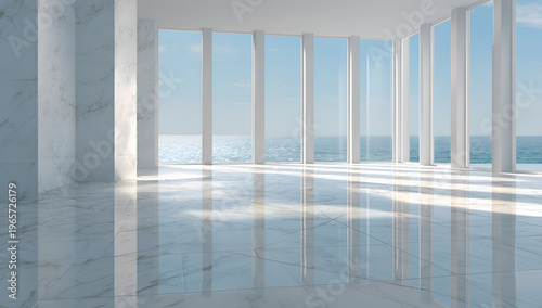 A modern, minimalist interior with marble floors and walls, flooded with sunlight from large windows overlooking the ocean