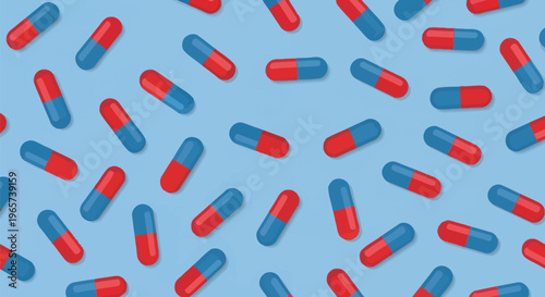 Scattered red and blue capsule pills against bright light blue background medical pharmaceutical healthcare concept detailed closeup view.