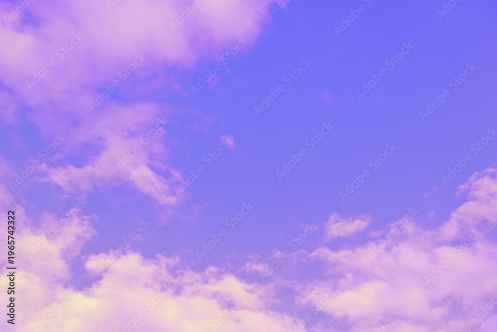 Obraz premium Vibrant purple sky background with soft pink clouds. Natural abstract and dreamlike landscape with dramatic and unique color tones for artistic design concept.