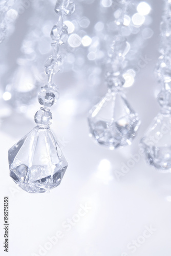 Close-up shot of a luxurious chandelier with crystal drops hanging from its frame