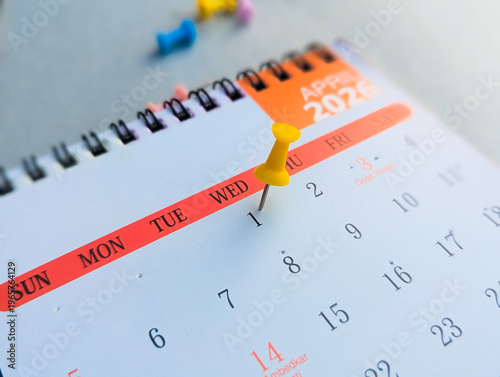 Yellow pushpin on April 1st 2026 calendar for April Fools' Day schedule