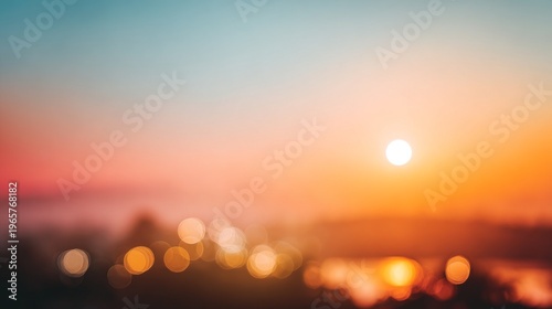 Bokeh sunset over city lights with warm orange and blue sky, and hazy horizon.