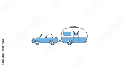 Vintage camper trailer being towed outdoors.