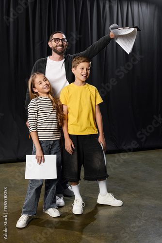 Bild auf Leinwand Stylish male tutor inspires kids in playful theater expression and creativity se