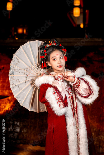 The ancient costume woman holding an oil paper umbrella