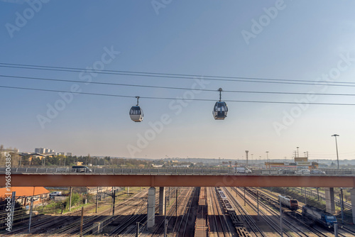 Paris, France - 03 19 2026: View The first cable car in Île-de-France and its gondolas above the road and rail lines